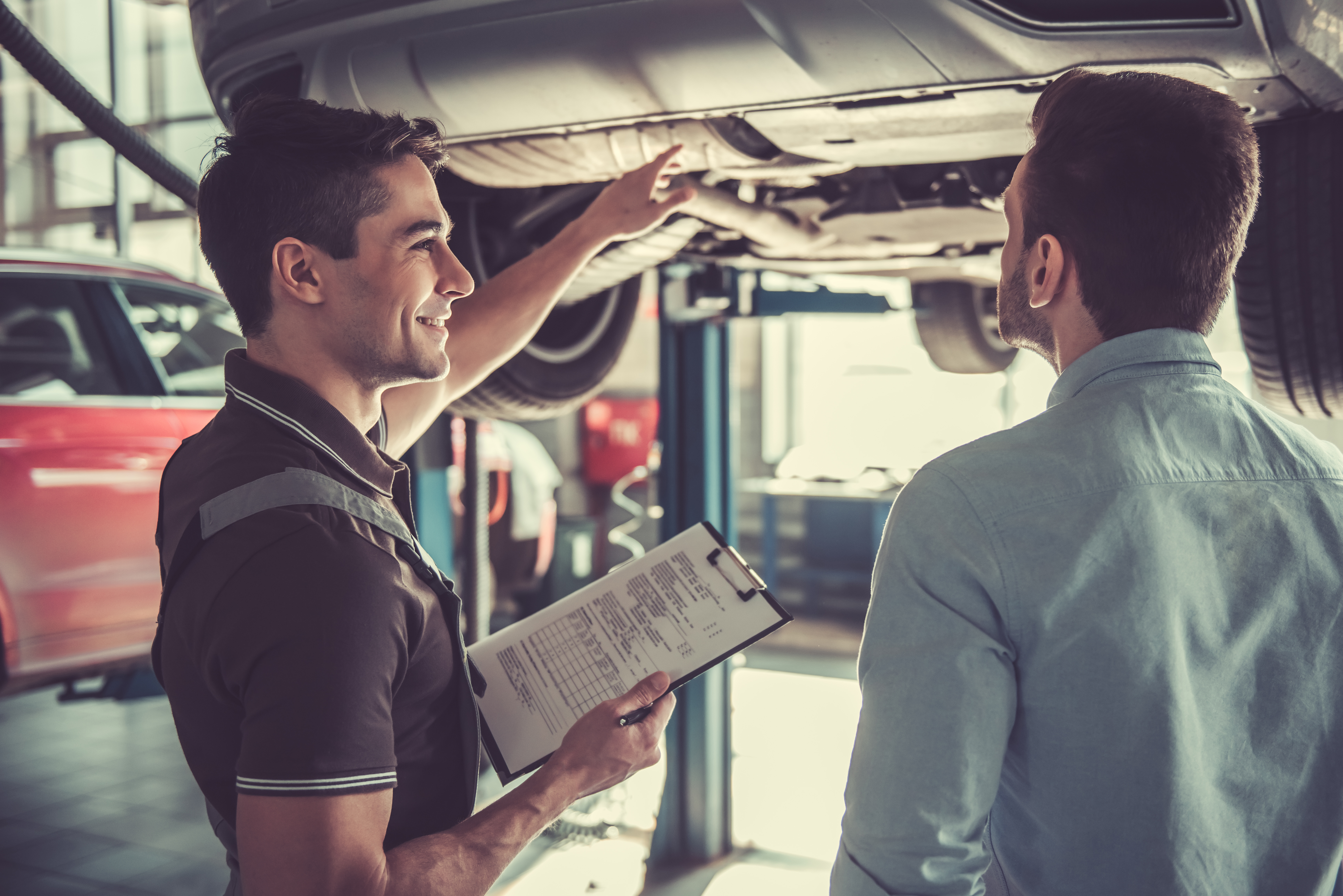Mechanic performing car care service at IN'n'OUT Autocentres