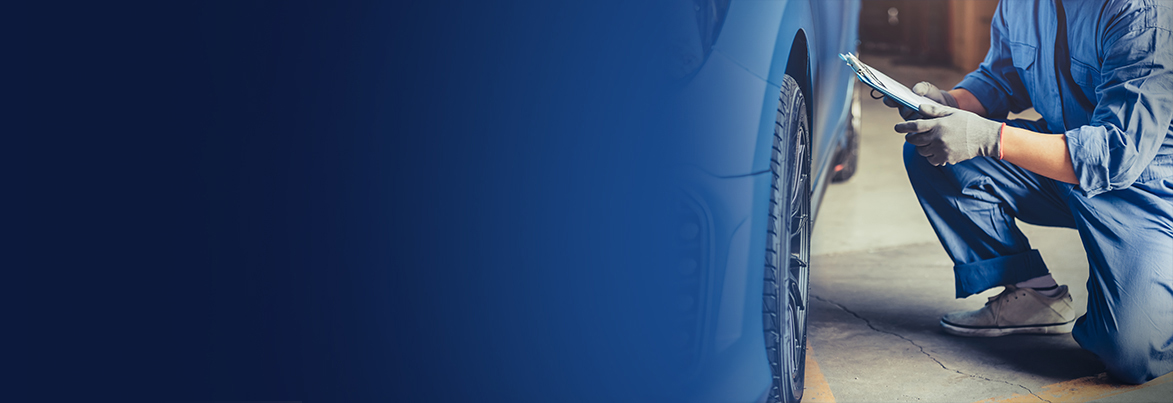 Mechanic performing vehicle maintenance