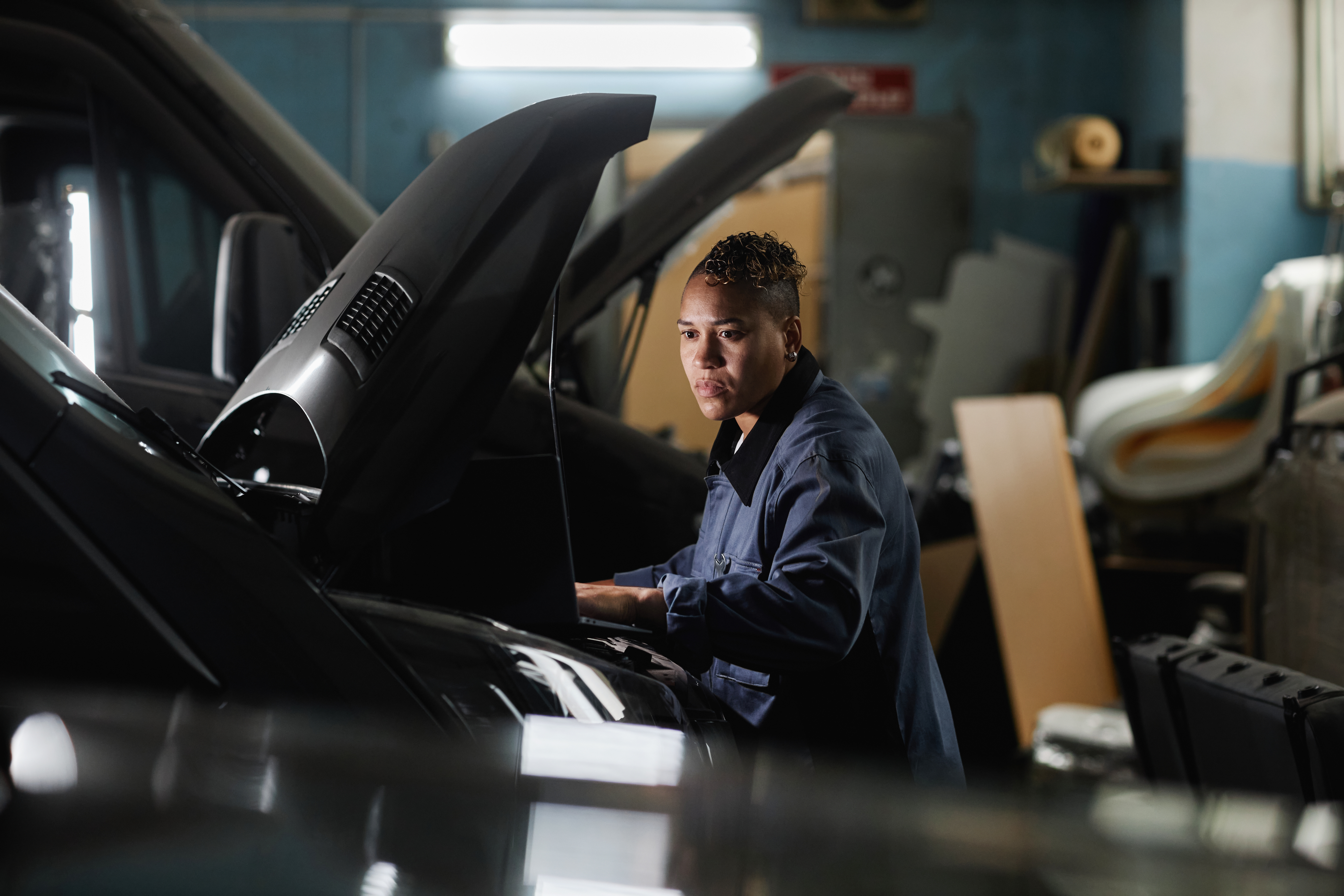 MOT technician carrying out vehicle inspection
